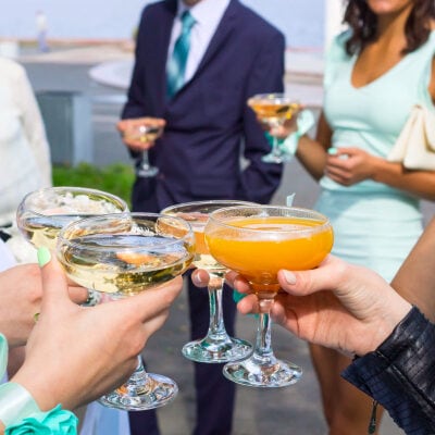 people toast cocktails at a semi-formal business event